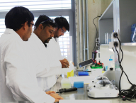 Dr. Roy giving lab training to PhD. students (Zubair and Qasim).